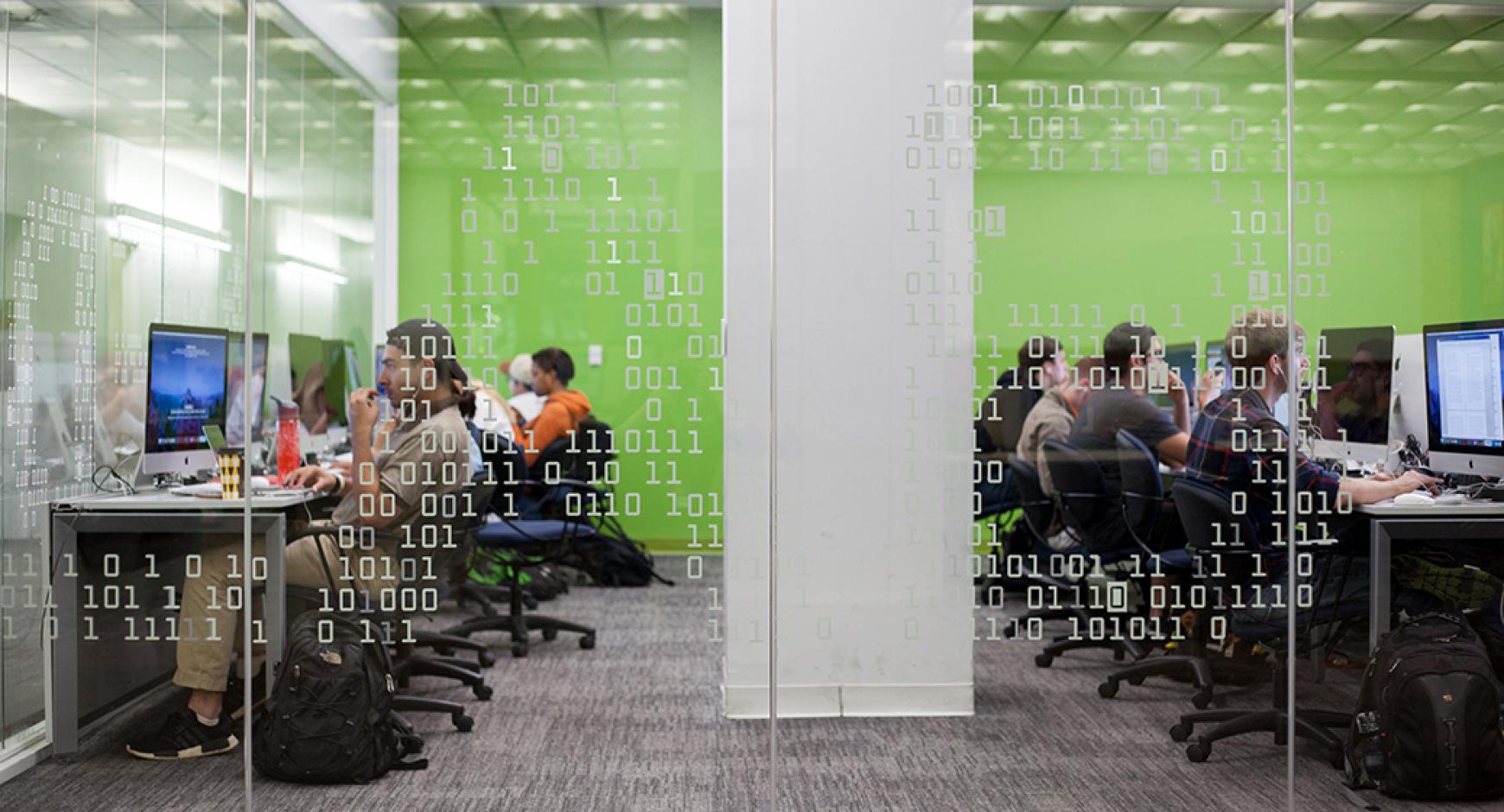 students in a media lab looking at computer screens