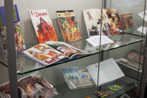 exhibition of book materials in a glass case