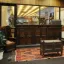 Front door to the Tarlton Library with a throw rug and wooden furniture