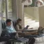 two persons looking at electronic devices