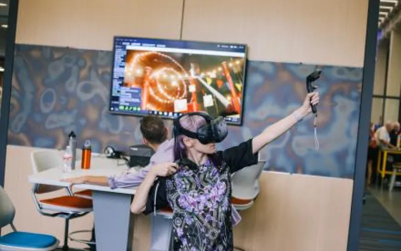 a person at the library foundry using a VR headset